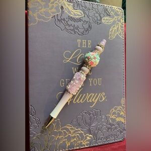 Floral Embossed Purple Journal with Hand Crafted Pen. Journal is 8.5 x 5.75”